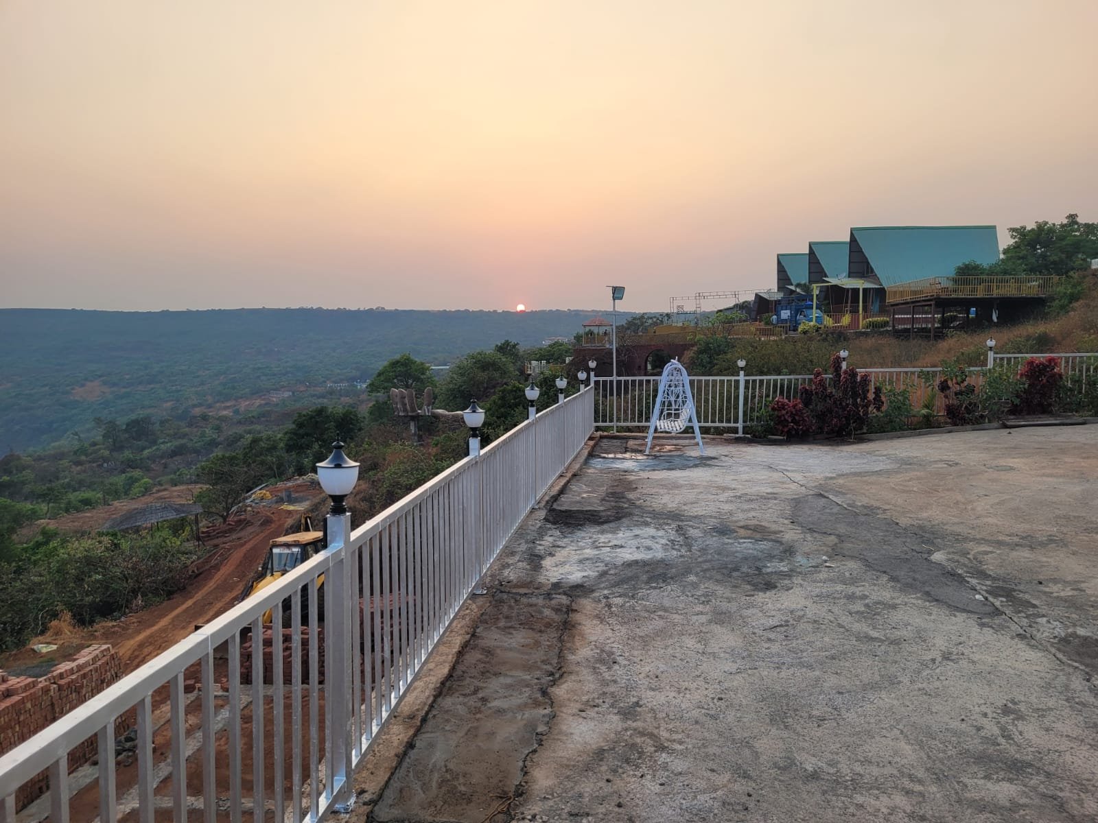 Wide early light across the terrace and valley